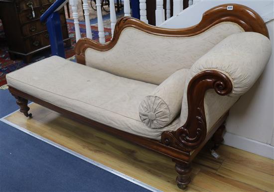 A Victorian carved satin walnut chaise longue